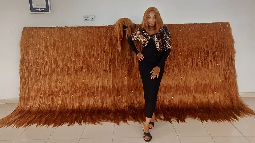 Another Nigerian Stylist Breaks Guinness World Record for Longest Handmade Wig
